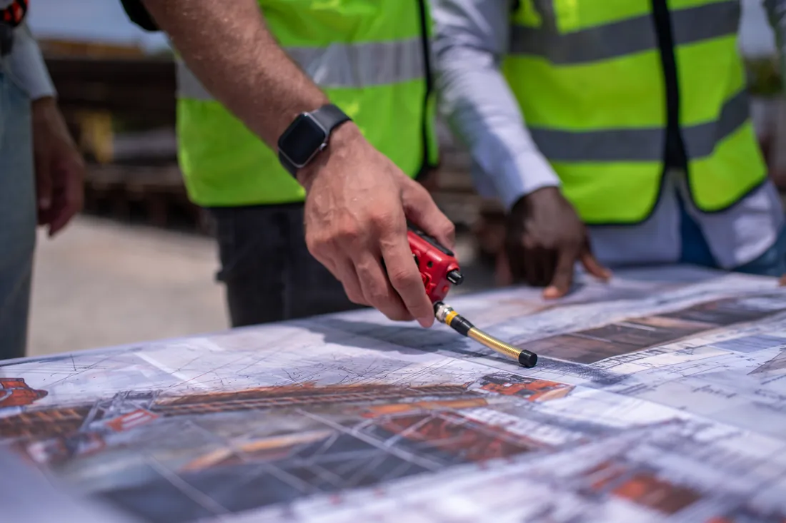 Engineers reviewing site drawings
