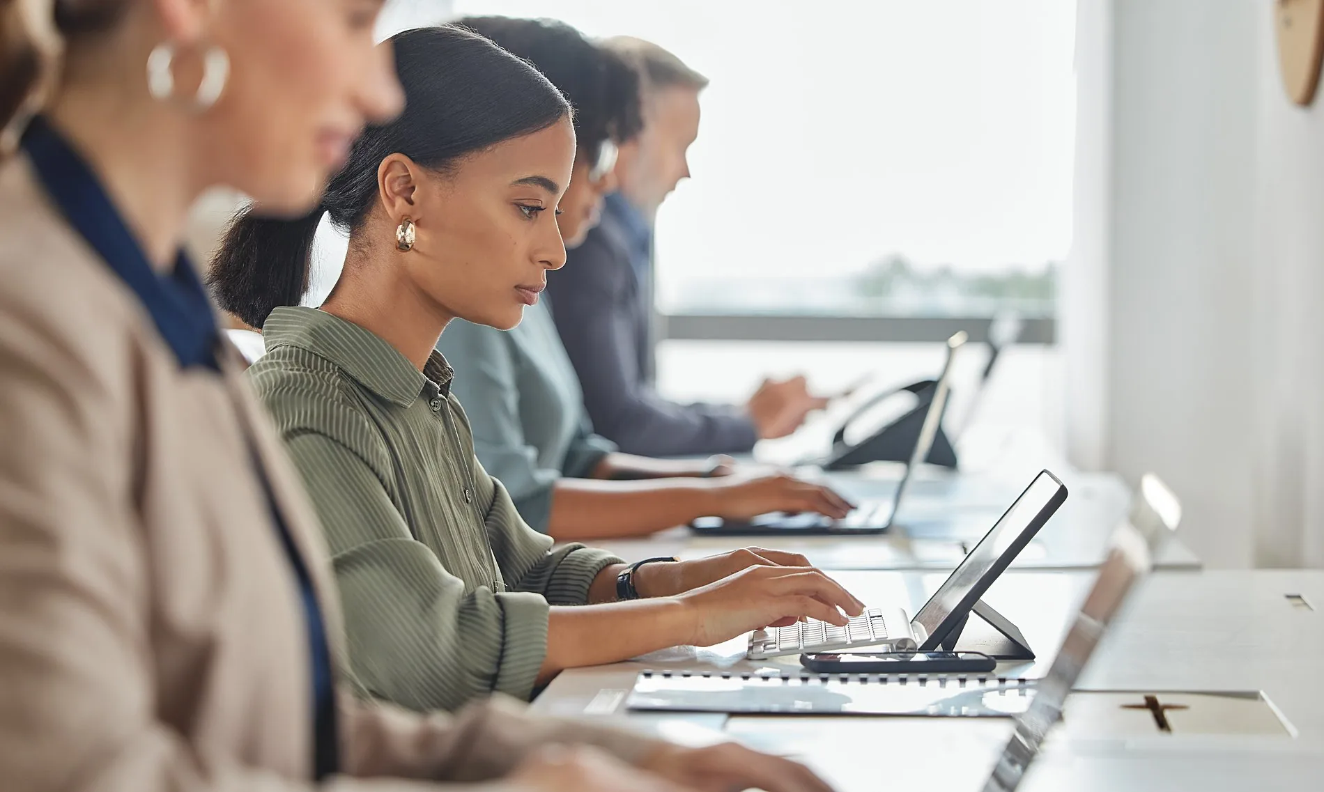 An IT team working at their screens