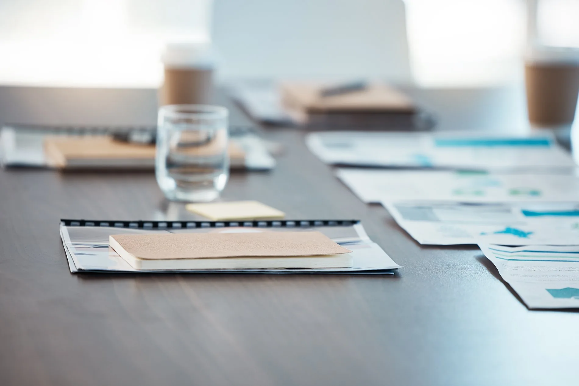 Plans and notes on a meeting-room table